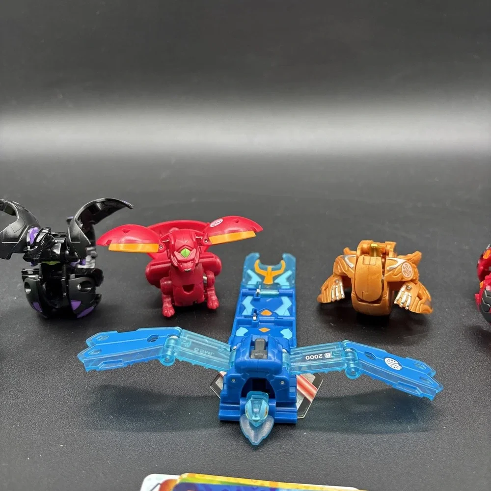 Lot Of 9 Bakugan Figures And 23 Bakugan Cards/Metal Card